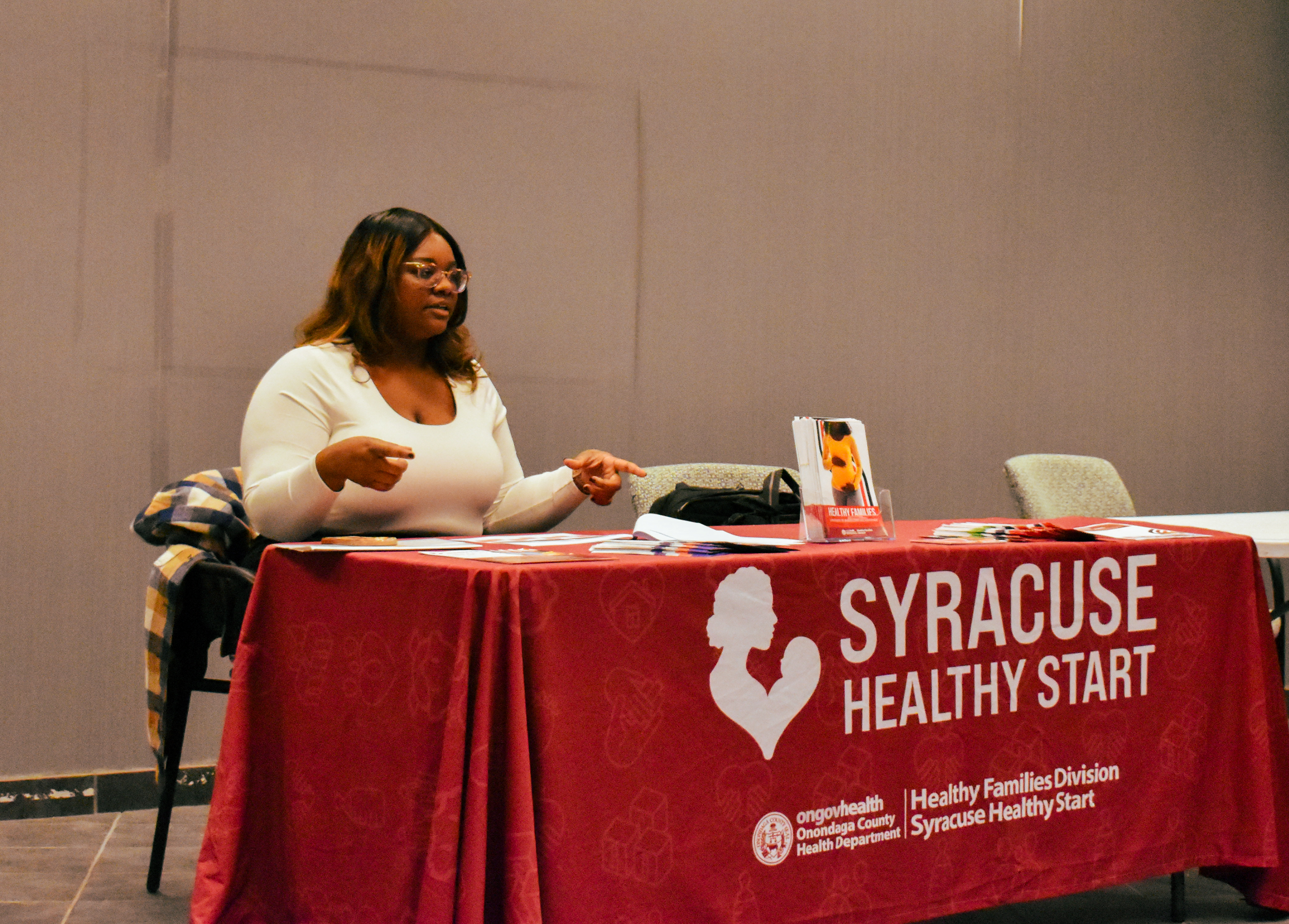 picture of Hillary Beaudouin, representative of Syracuse Healthy Start, conducting a presentation about the program and why access to healthy food is important